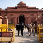 टेरर फंडिंग केस: शब्बीर शाह की पत्नी पर आज तय होंगे आरोप Patiala House Court Delhi building with police security barricades representing framing of charges in terror funding case