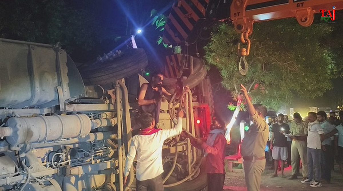 Emergency rescue workers removing concrete debris and an overturned cargo truck at a highway accident site in Amethi