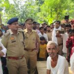 Police force inspecting damaged vehicles and maintaining security setup after communal tension at MahuaKola village in Hardoi