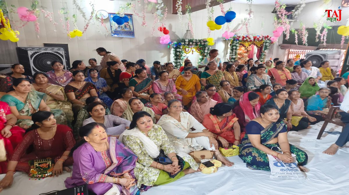 Traditional Hindu devotees listening to Srimad Bhagwat Katha sermon at Radha Krishna Temple in Kamala Nagar Agra