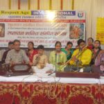 Musicians performing devotional classical songs on stage at an event in Agra review setup.