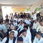 Lawyers and stamp vendors holding official strike press release document at Agra Sadr Tehsil campus review setup.