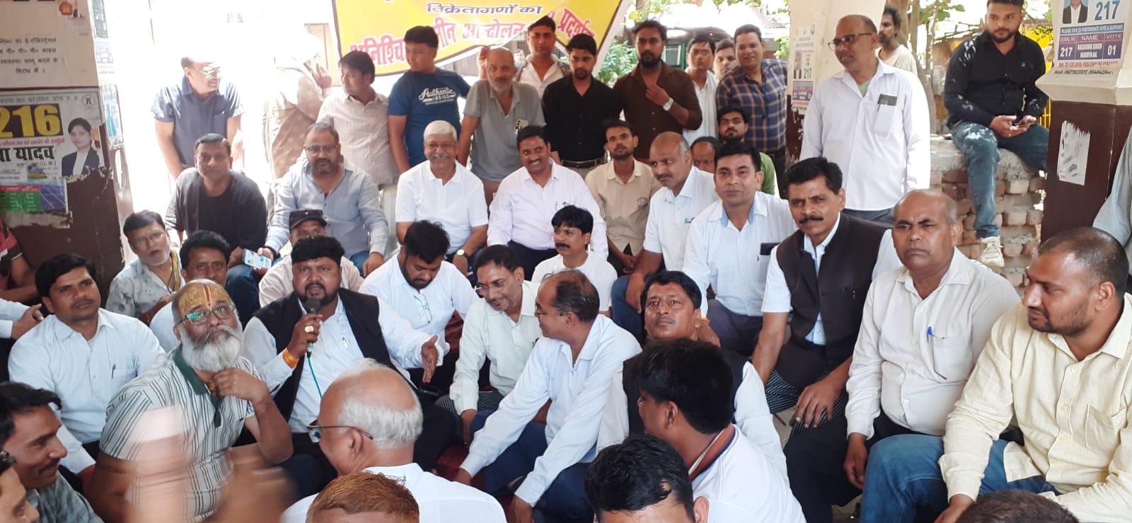 Committee officials signing the protest resolution at Agra tehsil office